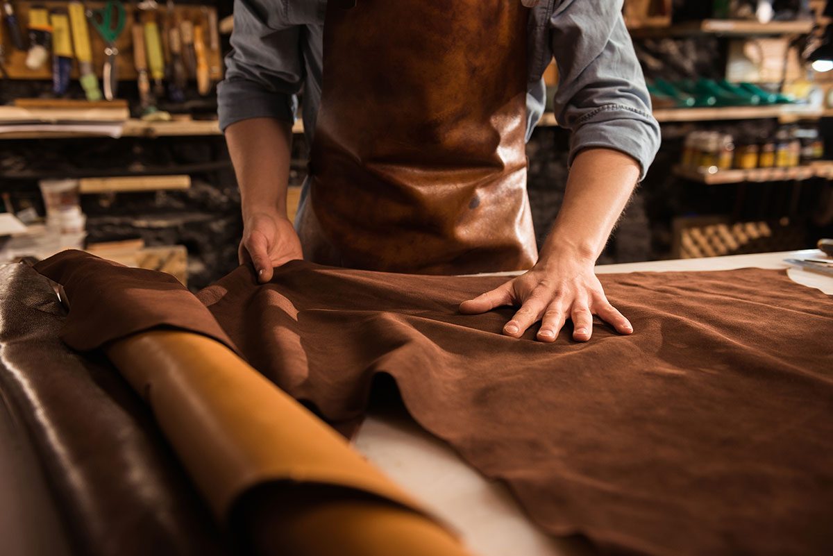 close-up-of-a-cobbler-working-with-leather-textile-resize.jpg